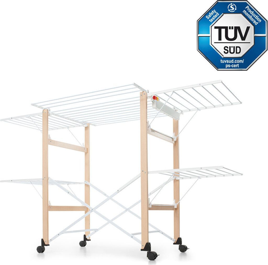 A multi-tiered clothes drying rack with wooden supports and white metal drying rods, shown on a white background. A TÜV SÜD certification logo is visible in the top right corner.