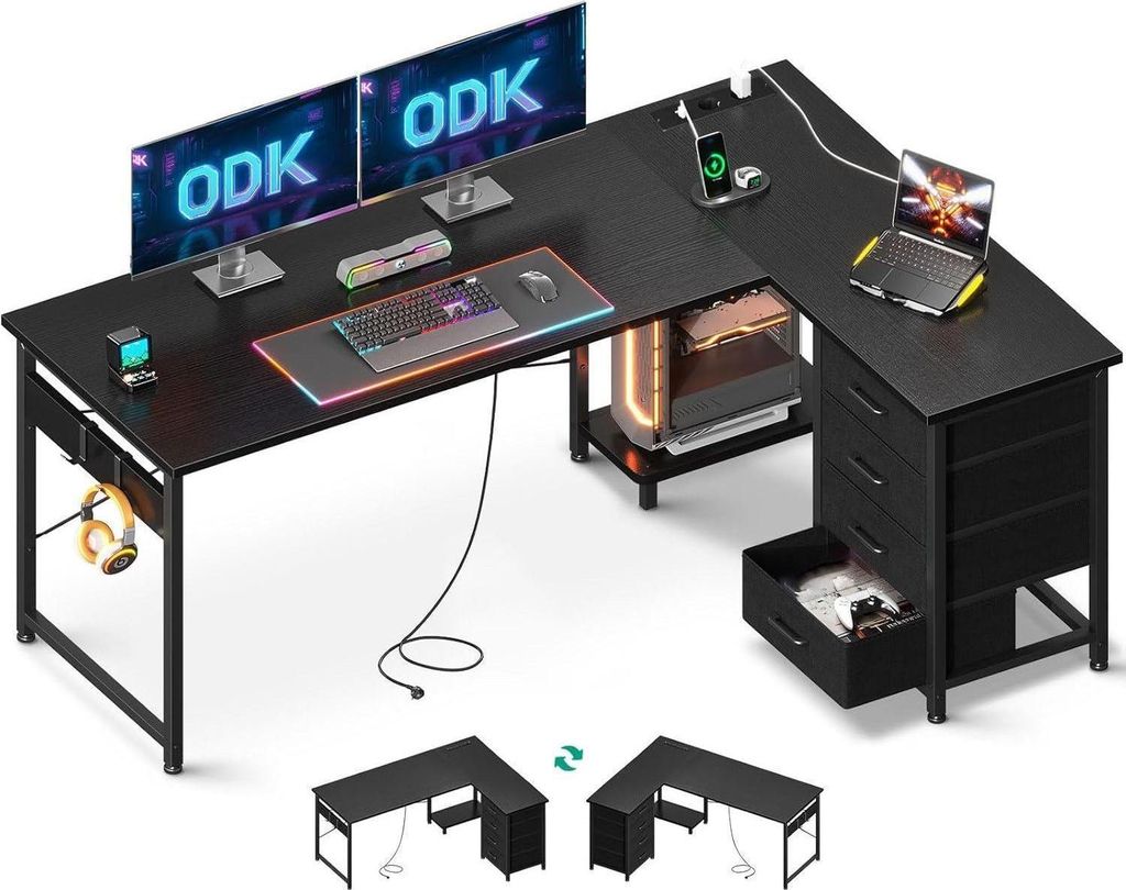 A black L-shaped gaming desk with dual monitors, a laptop, keyboard, mouse, and accessories.