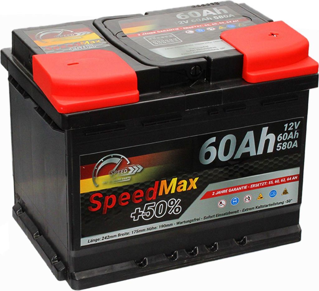A black car battery with red terminal covers, shown from a diagonal angle.