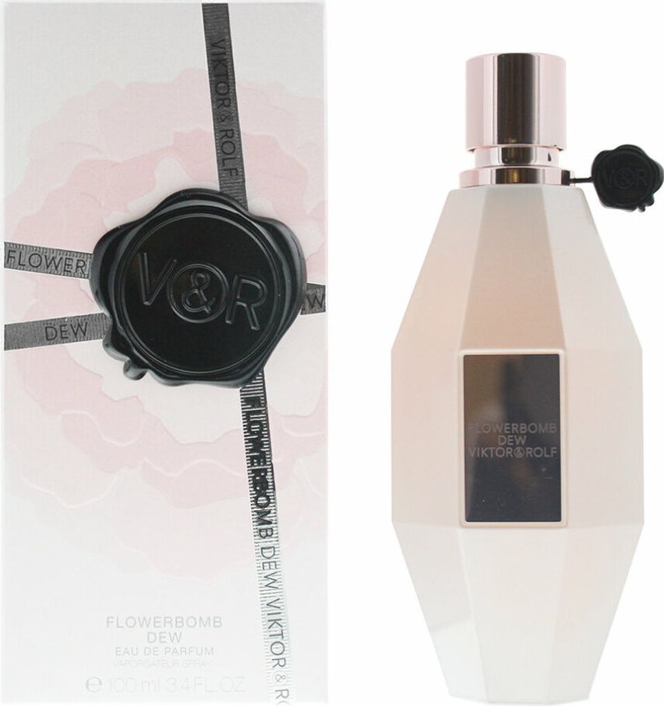 A perfume box and bottle are displayed side-by-side against a white background.