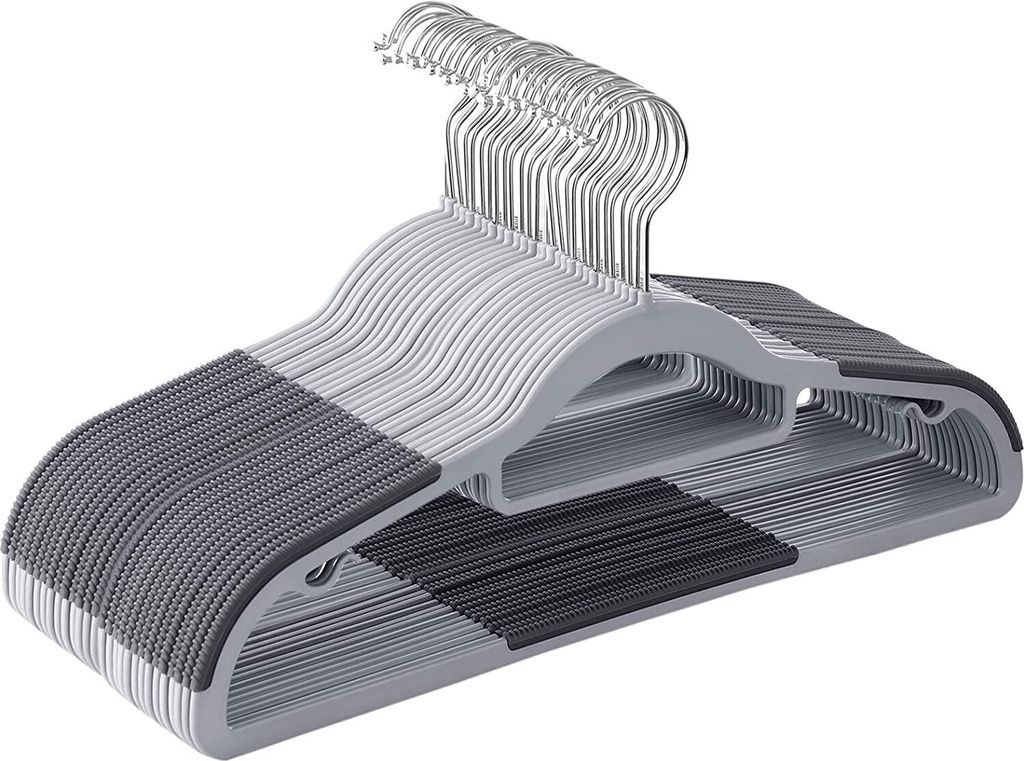 A stack of gray and dark gray plastic hangers.