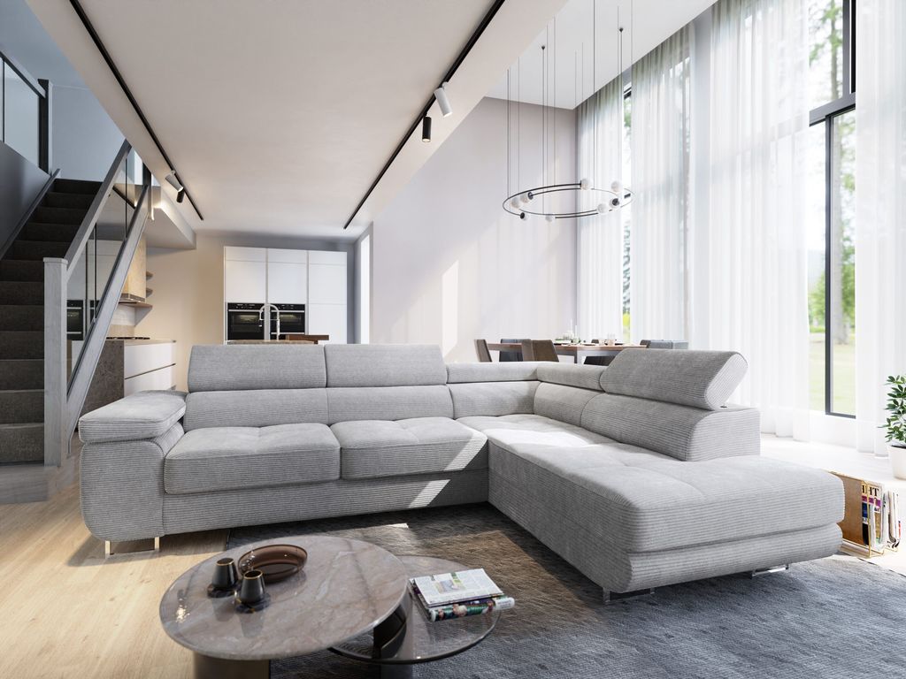 A modern living room with a large sectional sofa, coffee table, and dining area visible in the background.