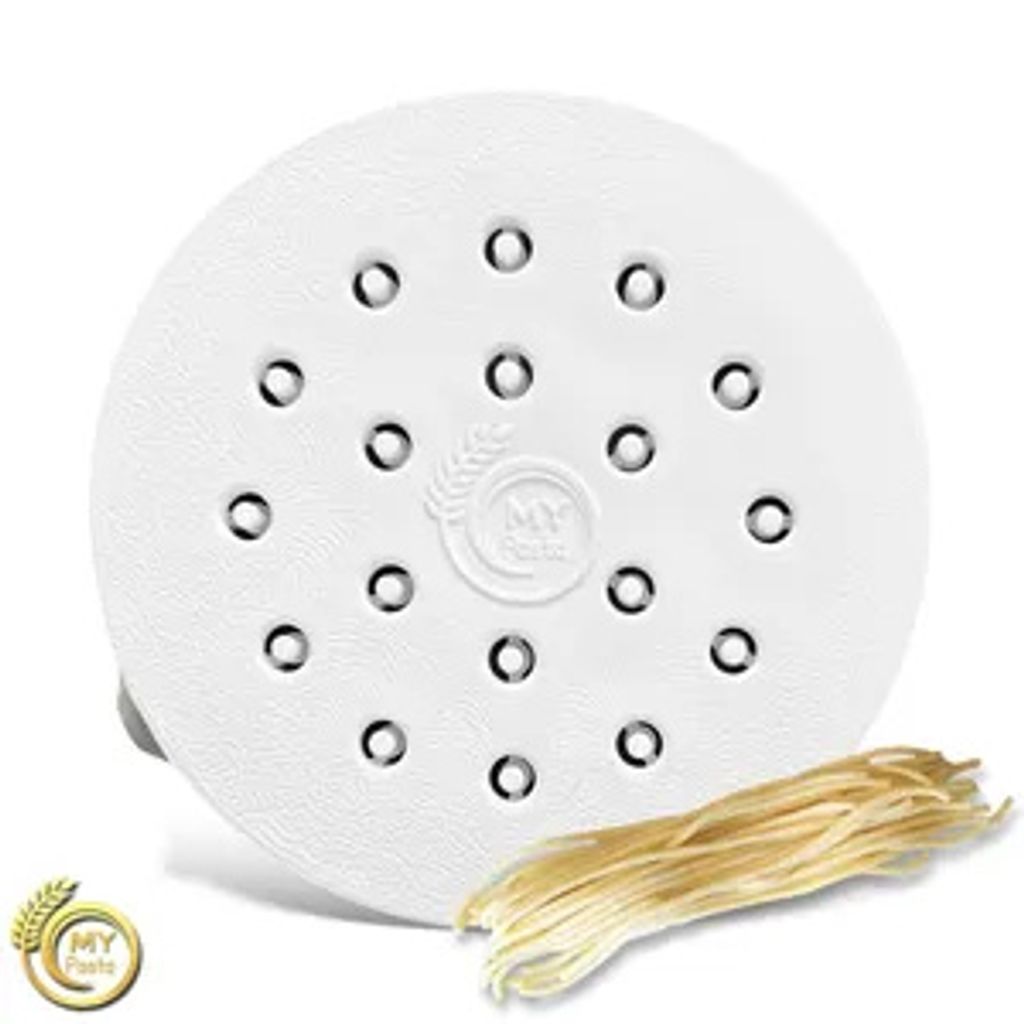 A white pasta maker attachment with a bunch of spaghetti next to it.
