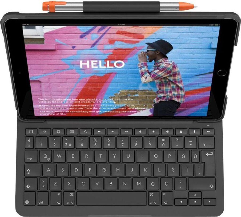 A tablet with a keyboard case is open, displaying a colorful background with the word 'HELLO' and a person.