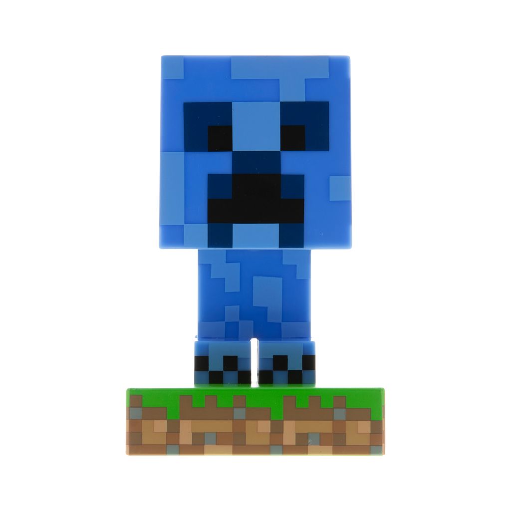 A blue Minecraft Creeper figurine standing on a grass and dirt block base.