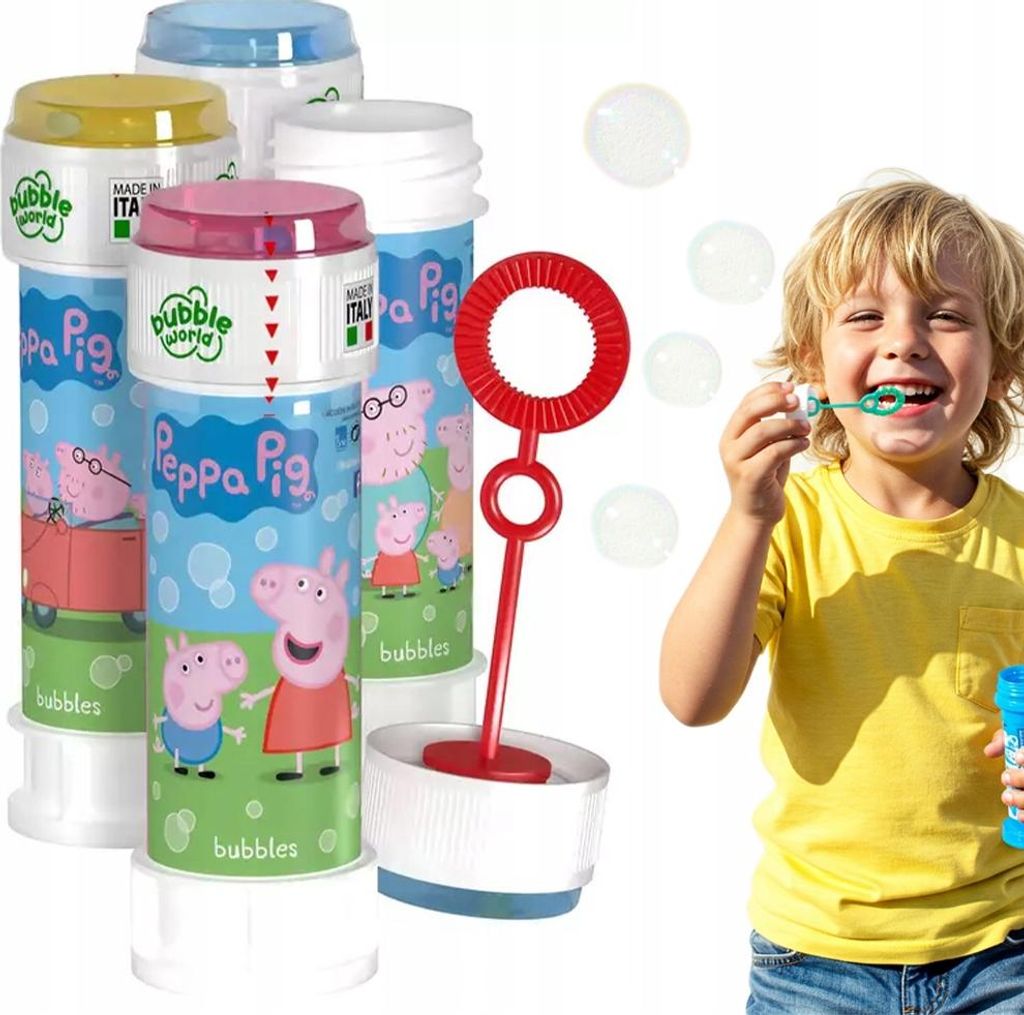 A child is blowing bubbles from a bottle of Peppa Pig branded bubble solution.
