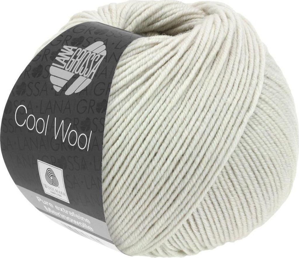 A ball of light gray yarn with a label.