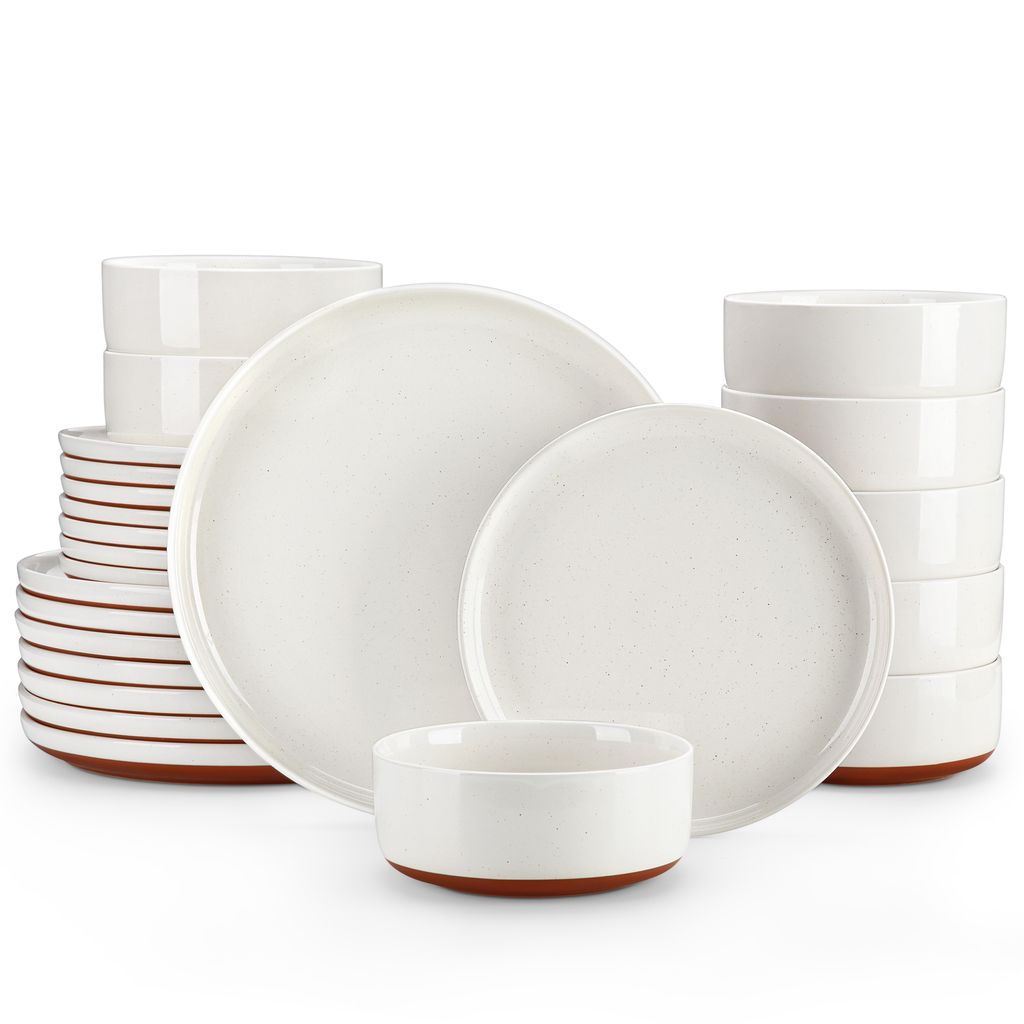 A collection of white ceramic plates and bowls with brown accents, arranged on a white background.