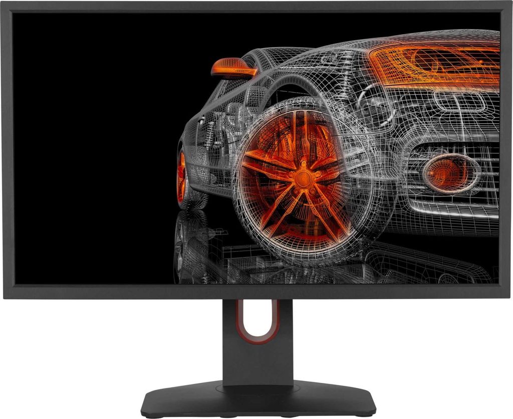 A wireframe rendering of a car on a black background, displayed on a monitor.