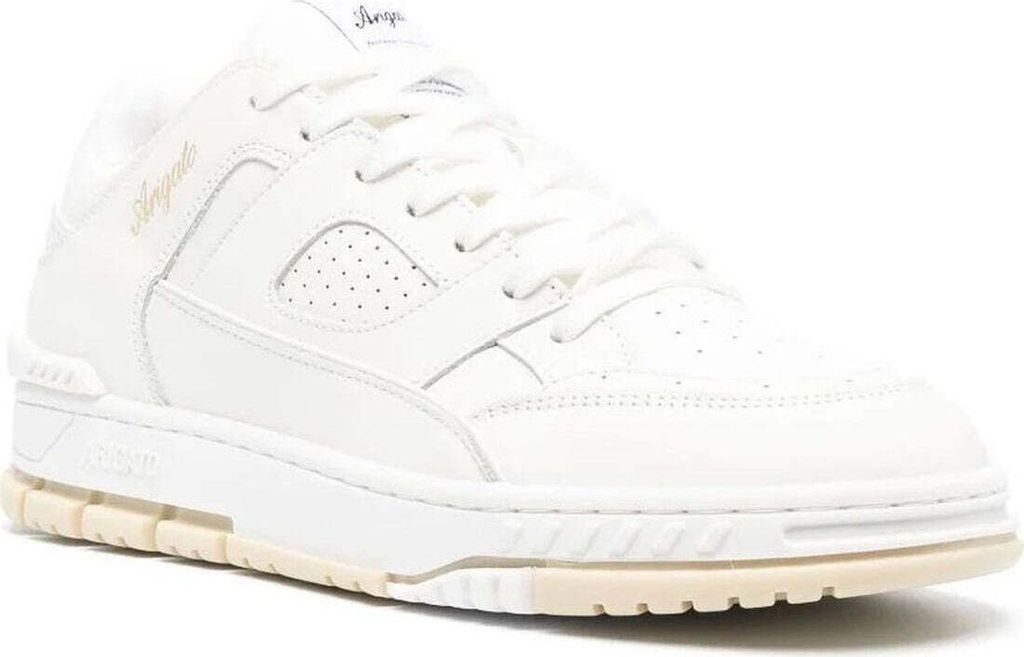 A white leather sneaker with a cream-colored sole.