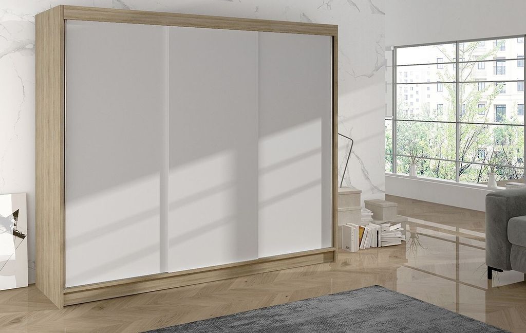 A sliding door wardrobe is shown in a room with a large window and a sofa.