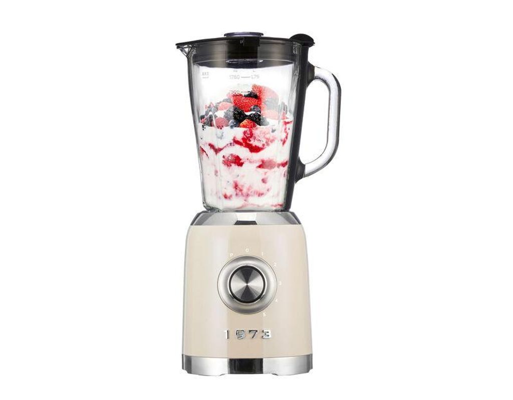 A beige stand mixer with a glass pitcher filled with berries and cream, set against a white background.