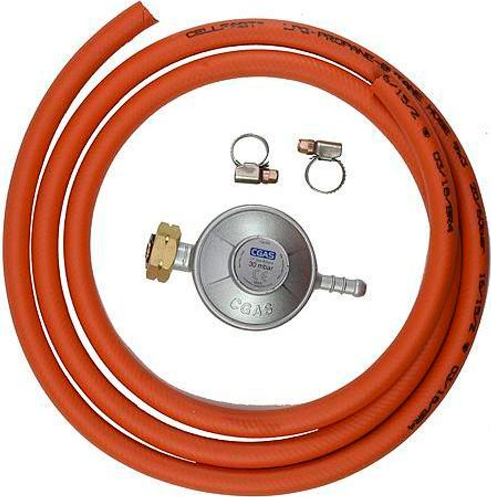 A gas regulator set with a hose and clamps on a white background.