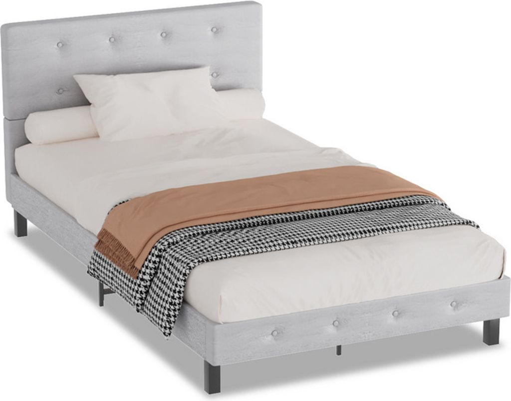 A bed frame with bedding.