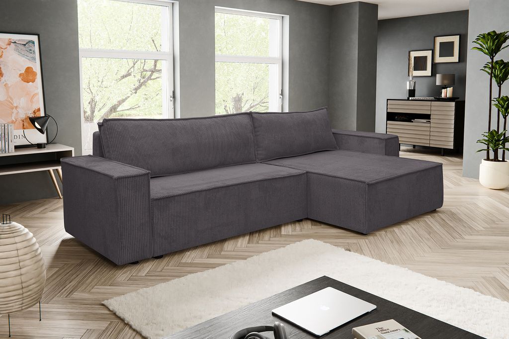 A dark gray sectional sofa is shown in a modern living room setting.