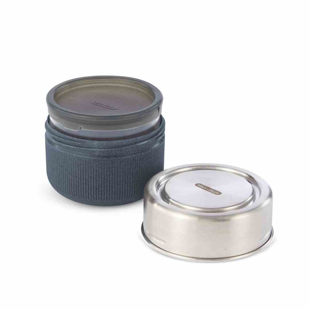 A glass lunch container with its lid separated, shown on a white background.