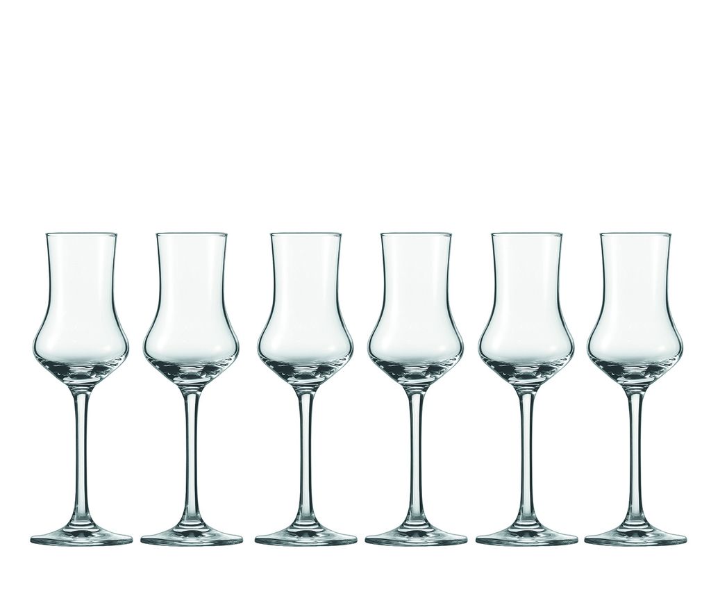 Six clear glass digestif glasses are arranged in a row against a white background.