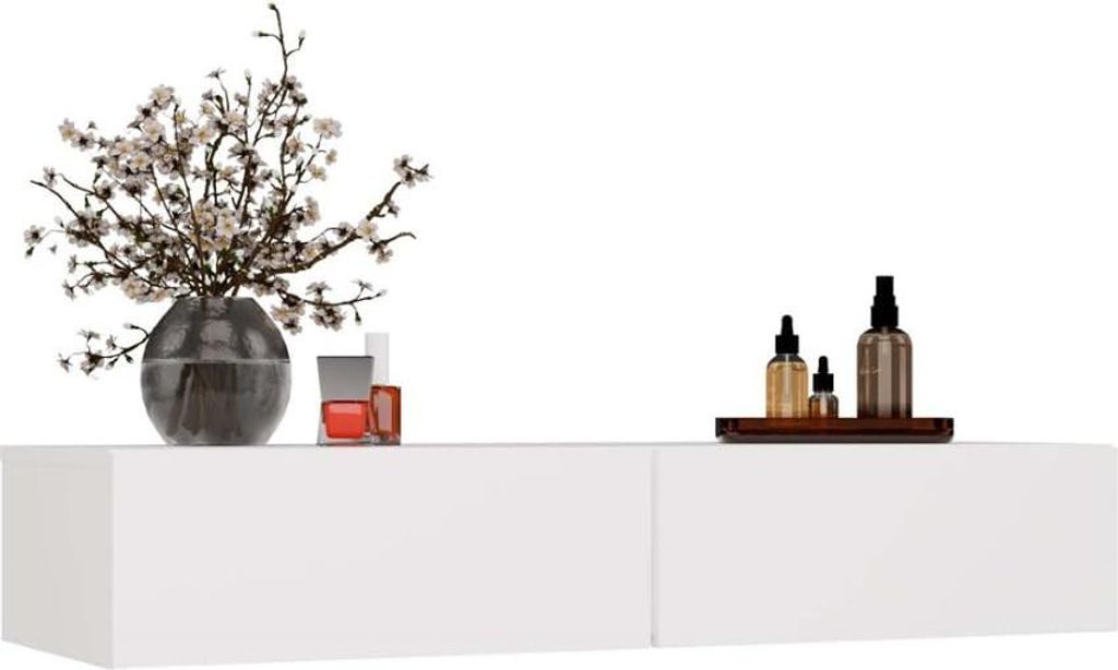 A white floating shelf with decorative items on top, including a vase of flowers and bottles.