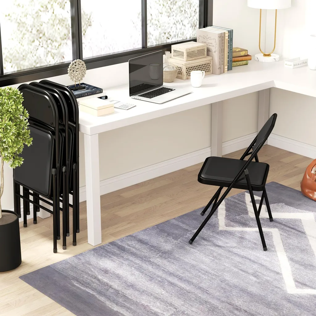 Lot de 4 chaises pliantes HOMCOM noir avec coussin et pieds en acier