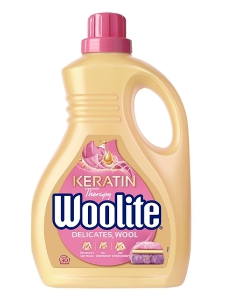 A bottle of Woolite laundry detergent with "Keratin Therapy" and "Delicates, Wool" labels.