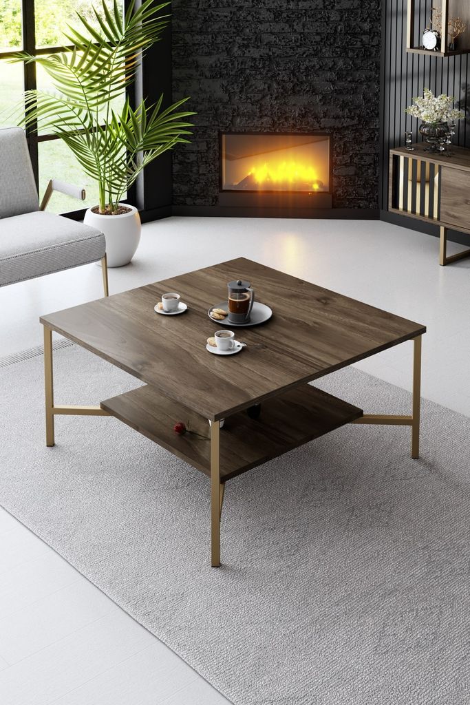 A living room scene with a fireplace, sofa, and coffee table.