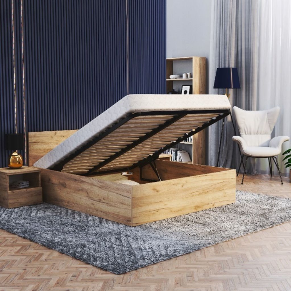 A bedroom scene with a bed with its storage open, a nightstand, a chair, and a bookshelf.