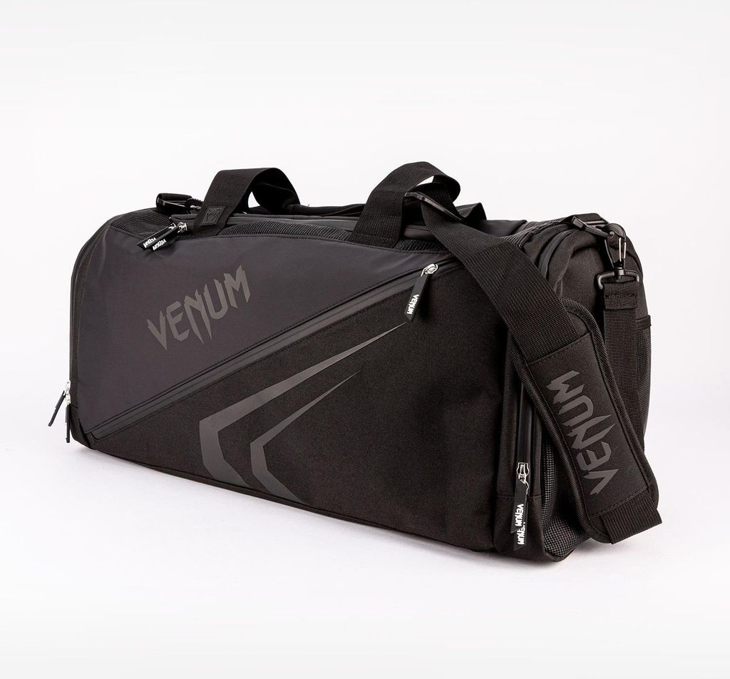 A black Venum duffel bag is shown against a white background.