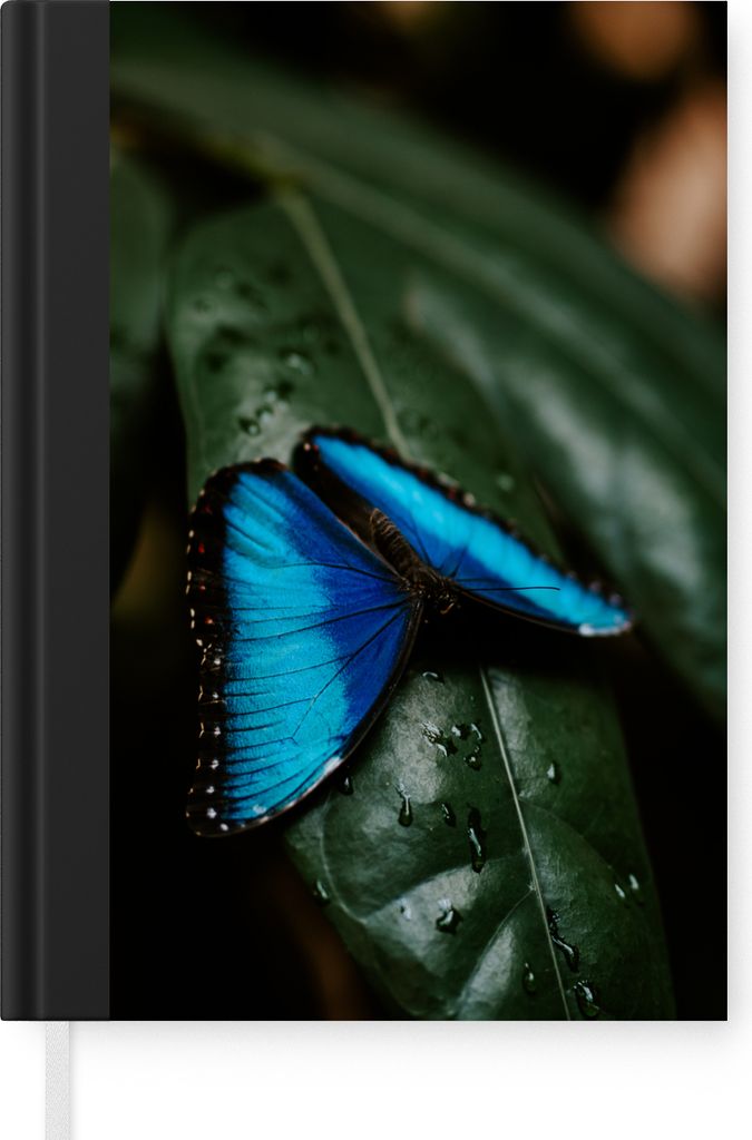 MuchoWow Notizbuch Tagebuch Haushaltsbuch Notebook A5 Abstrakte Darstellung eines blauen Schmetterlings auf einem grünen Blatt - Notizblock - No...