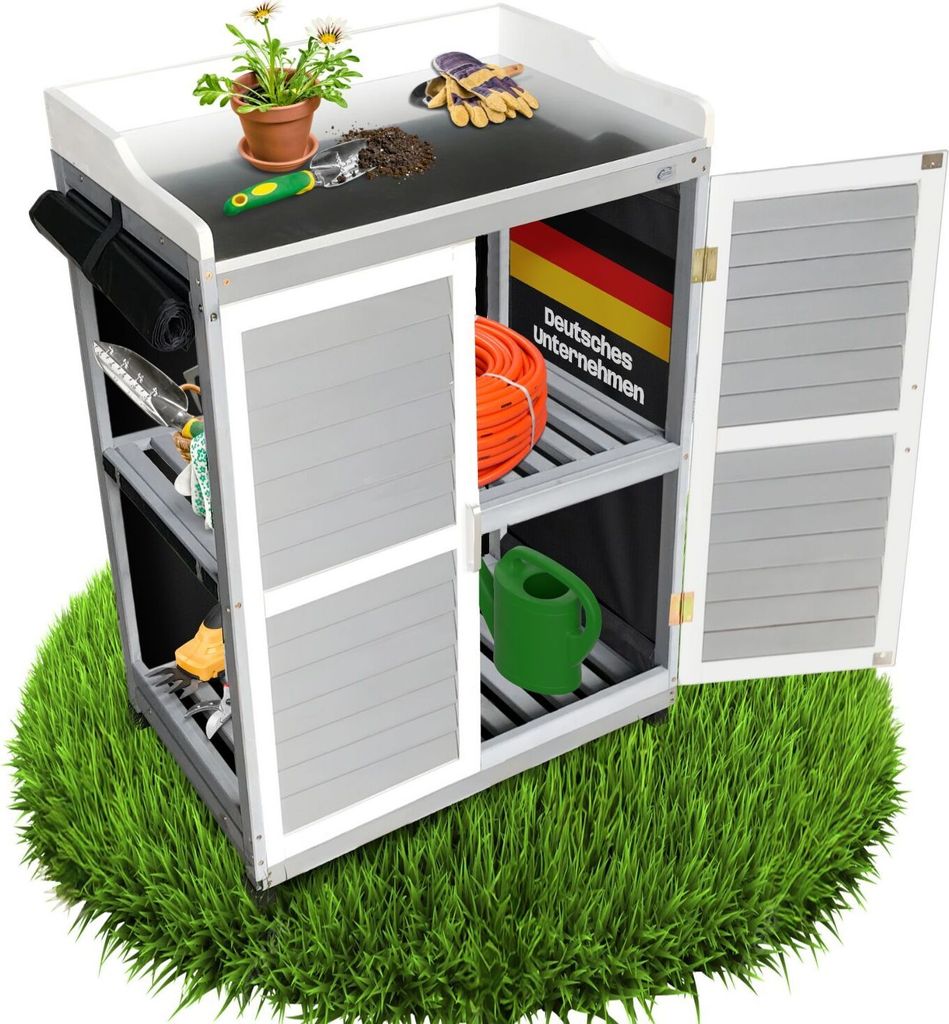 A garden cabinet with various gardening tools and supplies displayed on a patch of grass.