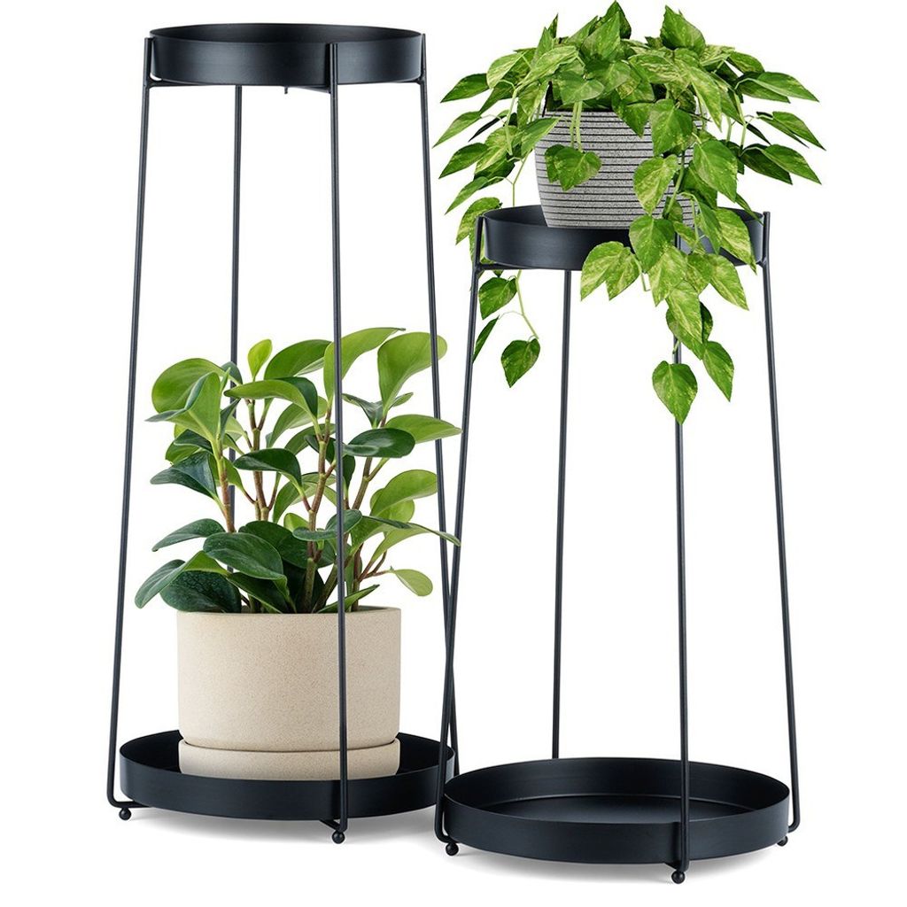 Two black metal plant stands, each holding a potted plant, are displayed against a white background.