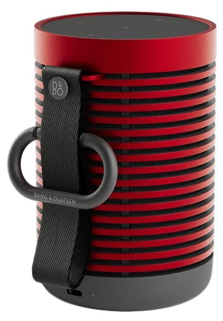 A close-up studio shot of a red and black portable speaker.