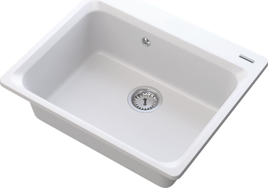 A white kitchen sink with a silver drain.