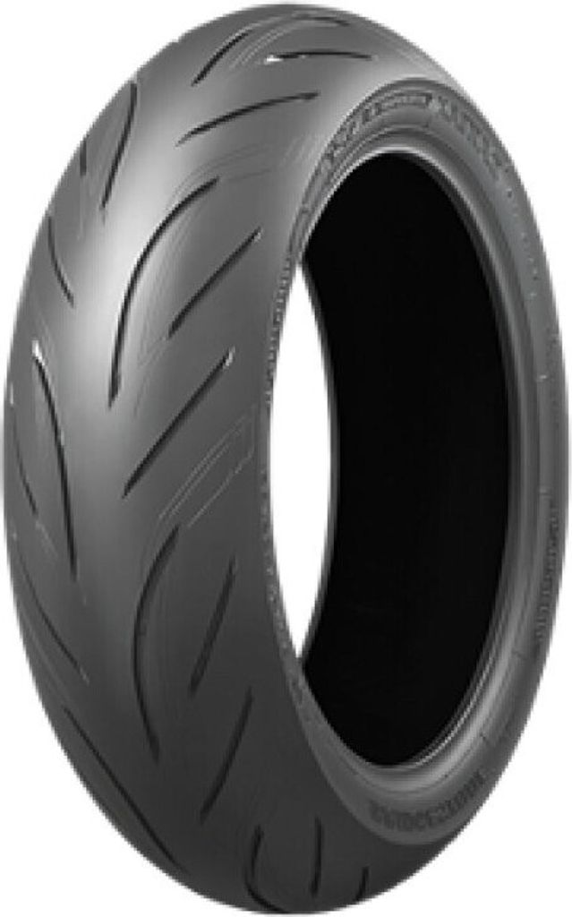 A studio shot of a single motorcycle tire against a white background.