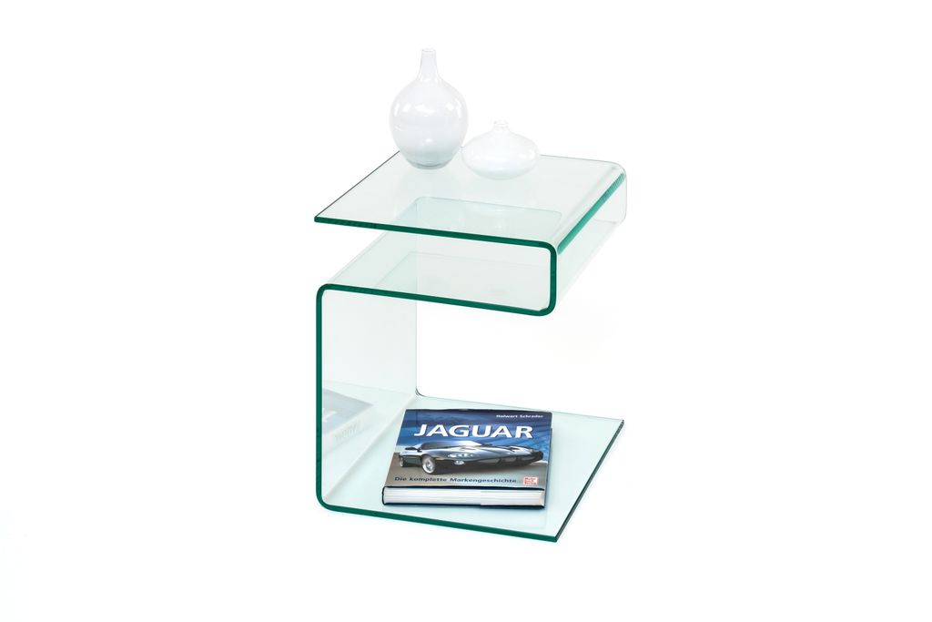 A clear glass side table with two decorative vases and a book on it, isolated on a white background.