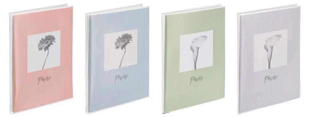 Four pastel-colored photo albums are displayed side-by-side against a white background.