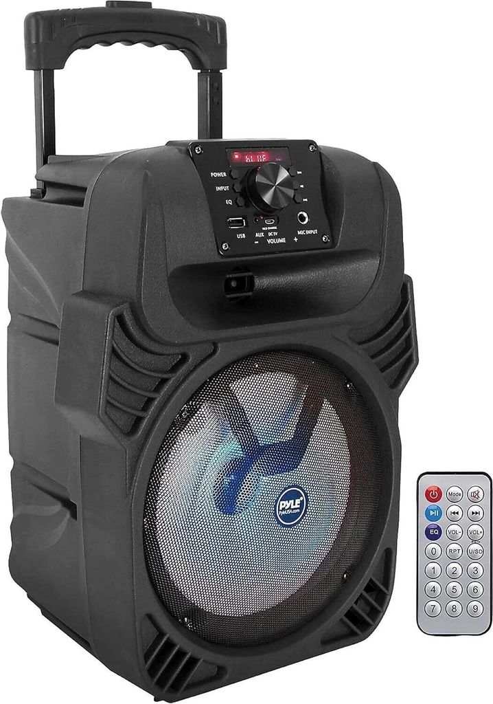 A black portable speaker with a handle and wheels, shown with a remote control.