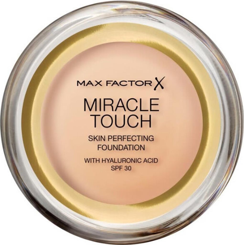 A top-down view of an open jar of foundation.