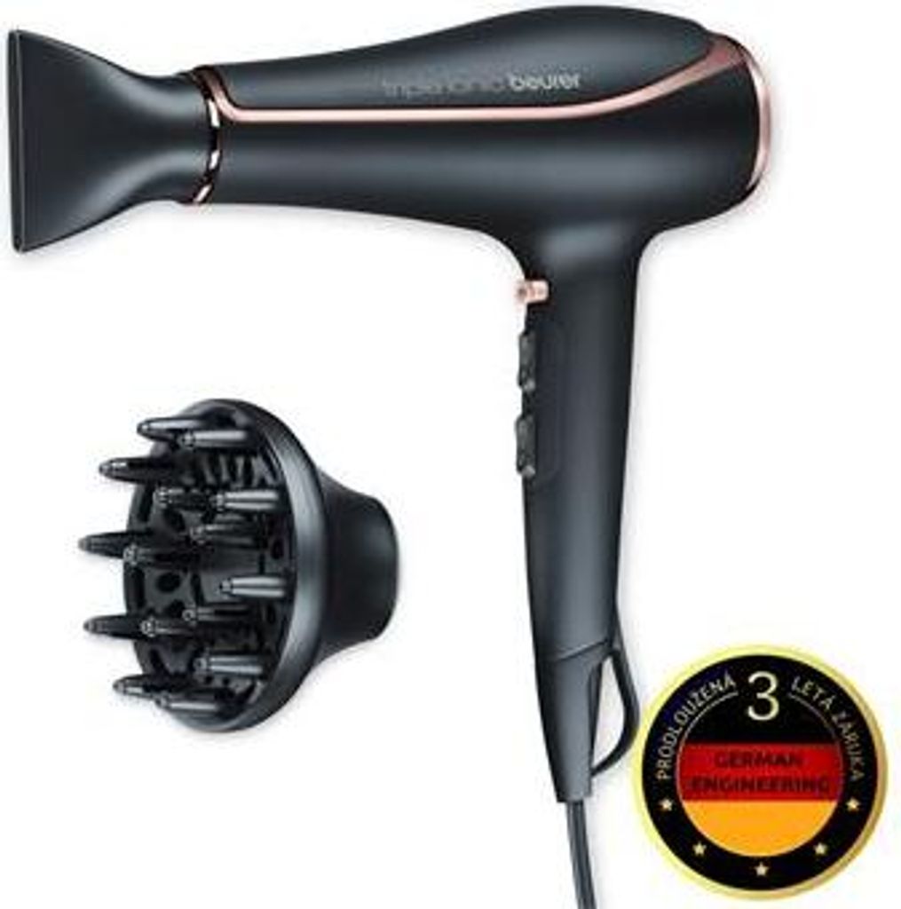 A black hairdryer with rose gold accents and a diffuser attachment, presented on a white background. A circular badge with text and a German flag is also visible.