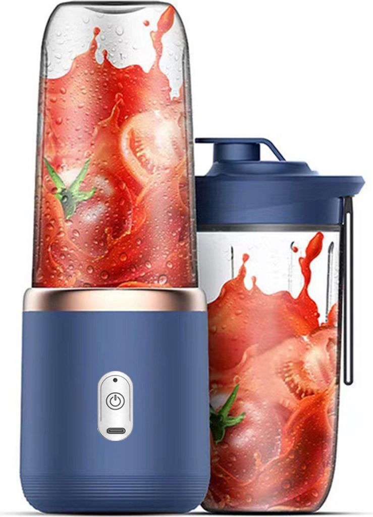 Two portable blenders with tomatoes and juice splashing inside.