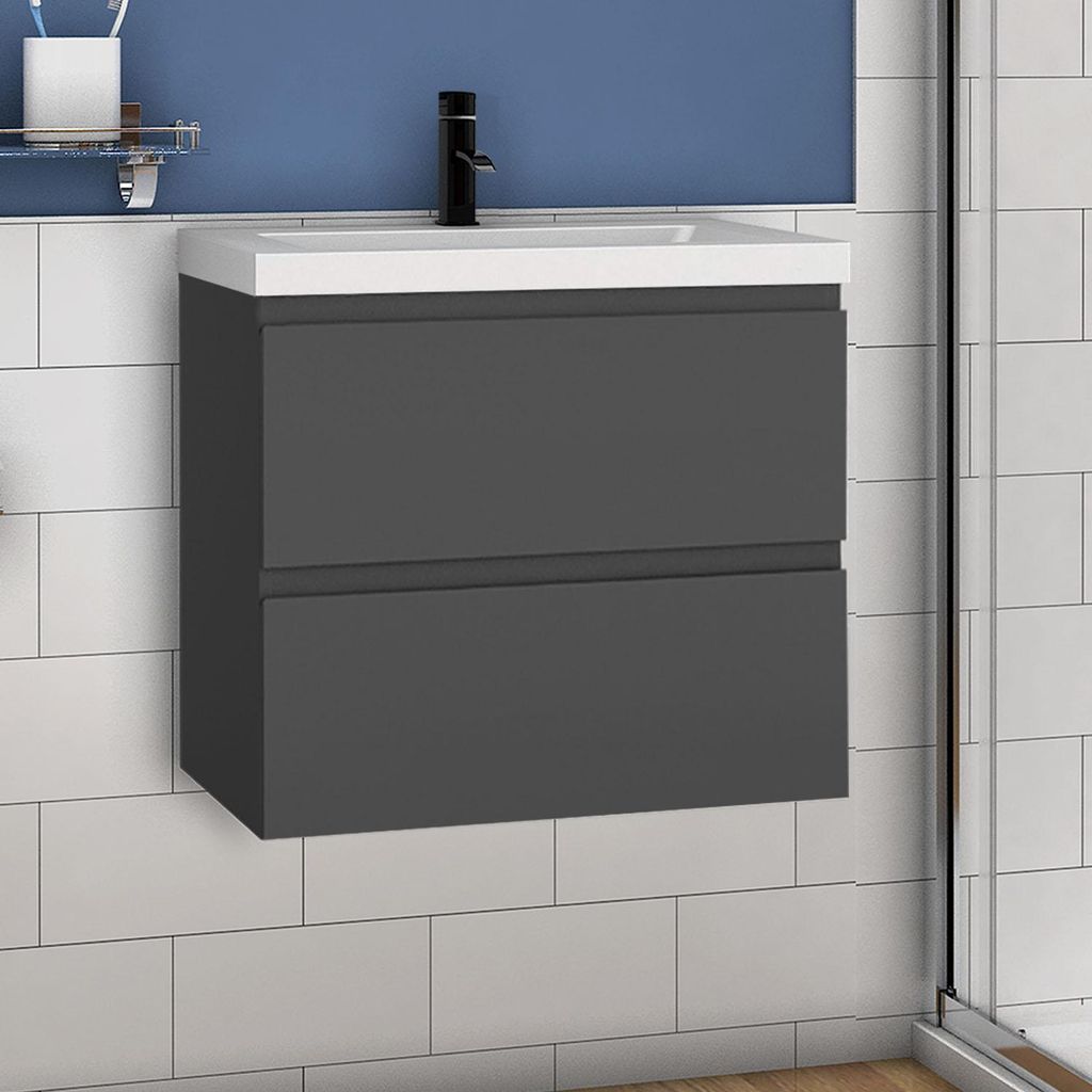 A modern dark gray bathroom vanity with a white countertop and a black faucet, mounted on a white tiled wall with a blue upper wall.