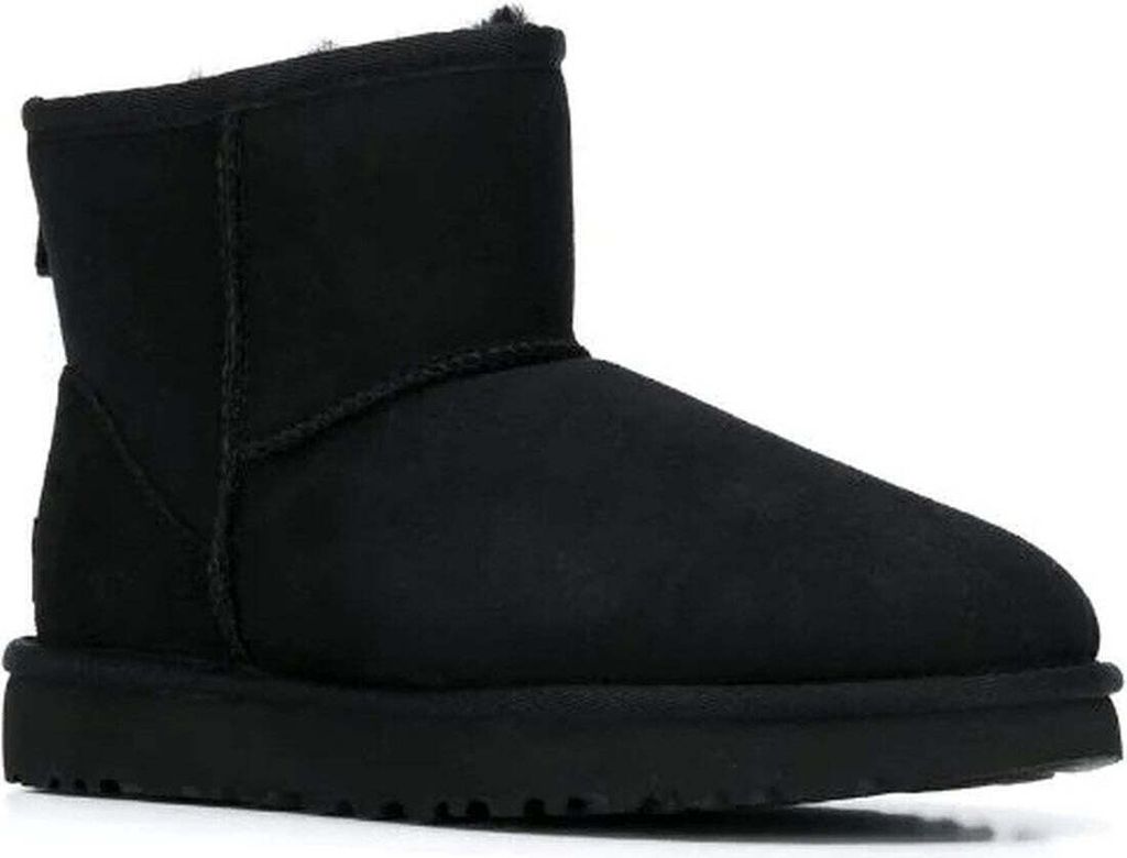 A black UGG boot is shown against a white background.