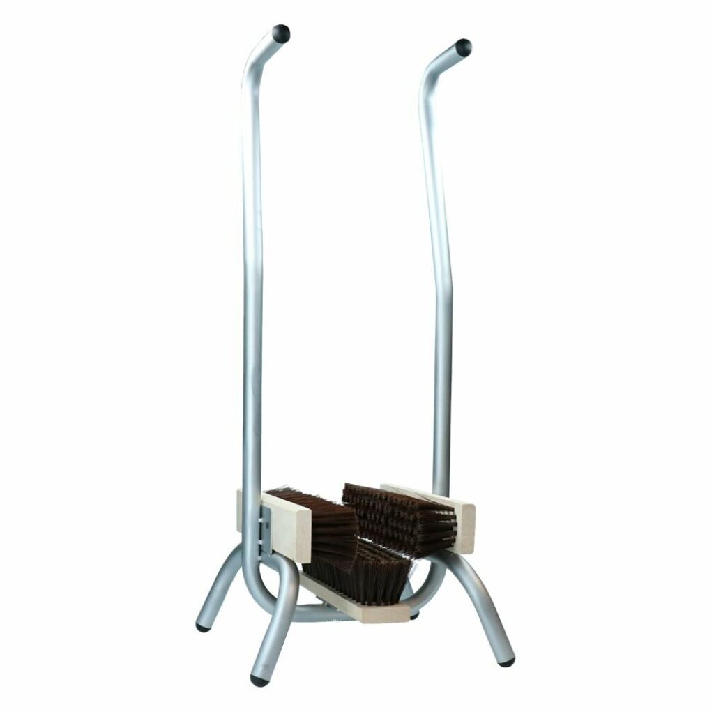 A boot scraper with two brushes and metal handles.