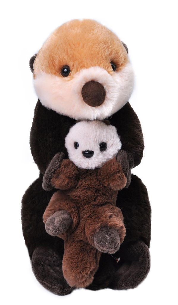 A plush toy otter holding a baby otter.