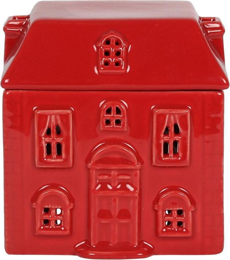 A red ceramic house-shaped oil burner.