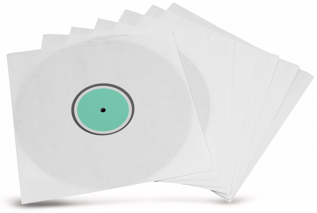 A stack of white LP record sleeves, with one sleeve showing a white record with a green label.