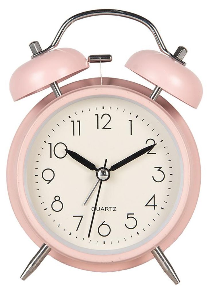 A pink analog alarm clock with silver bells on top, set against a white background.