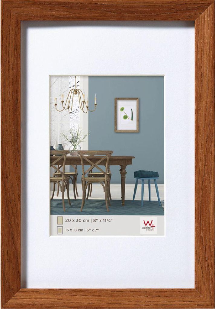 A framed picture of a dining room scene.