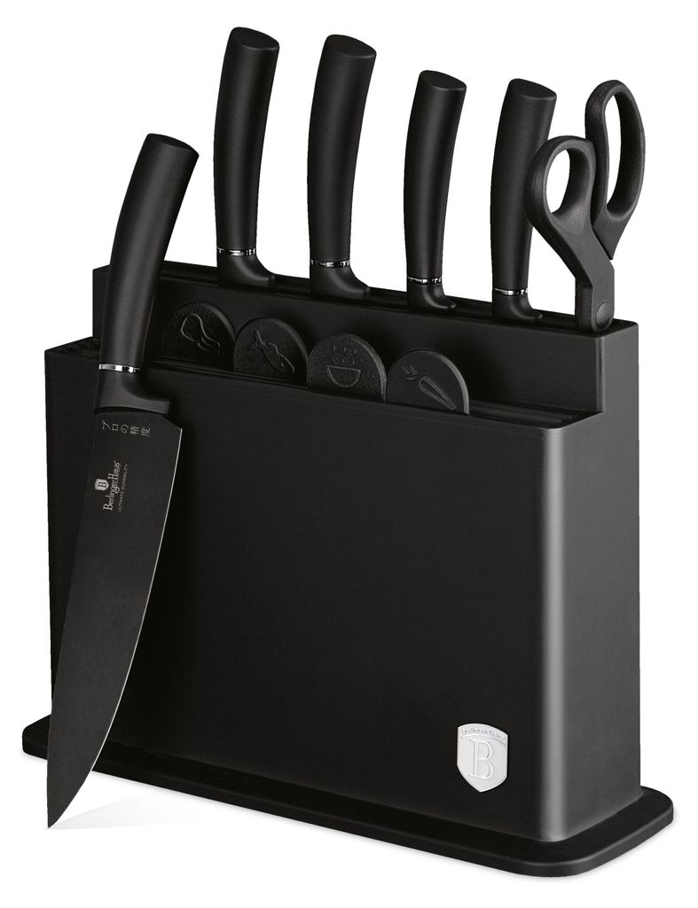 A black knife block with several knives and scissors inserted.