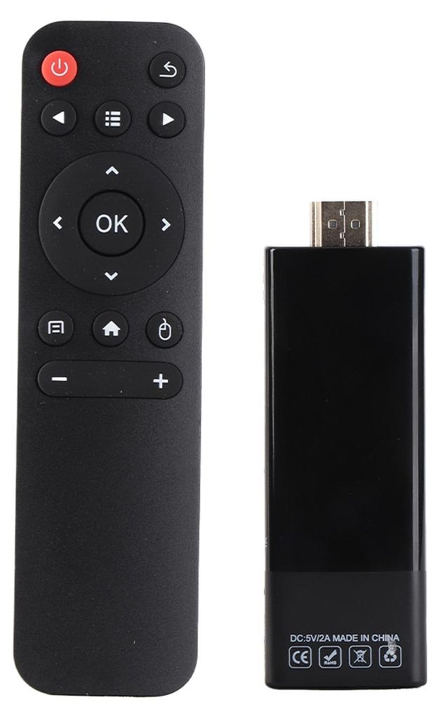 A black TV stick and its remote control are placed side-by-side on a white background.