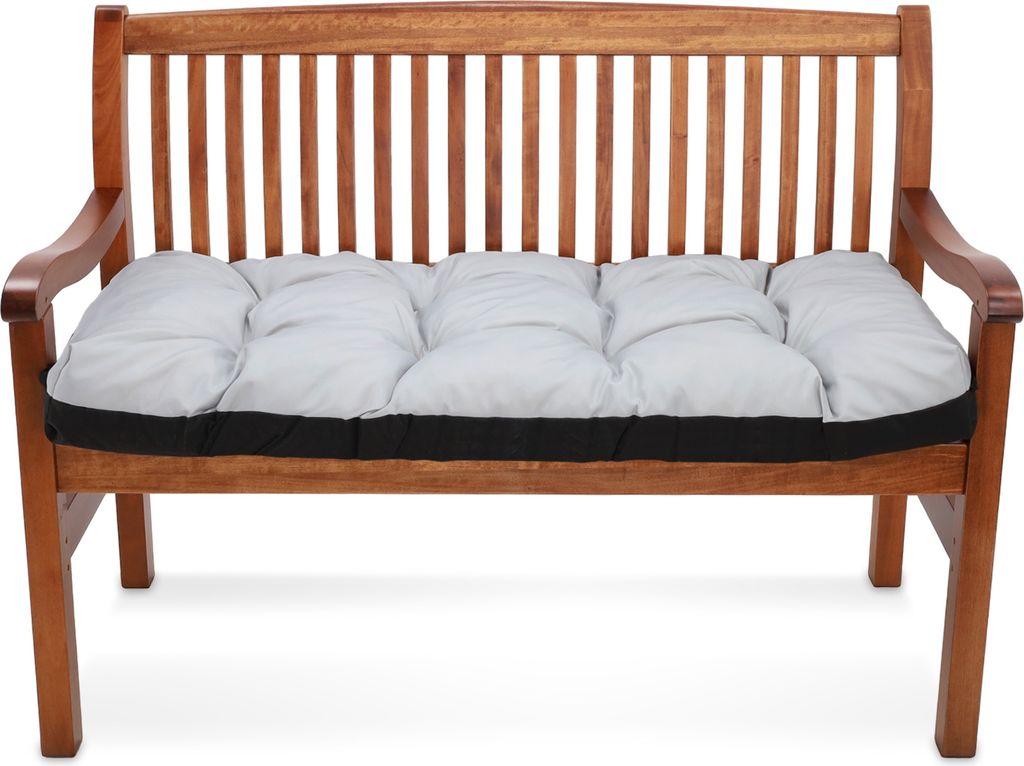 A wooden bench with a gray cushion.